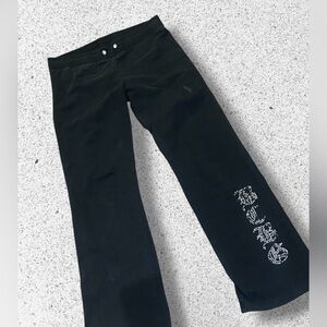 Y2K BCBG Max Azria rhinestone-embellished sweatpants.